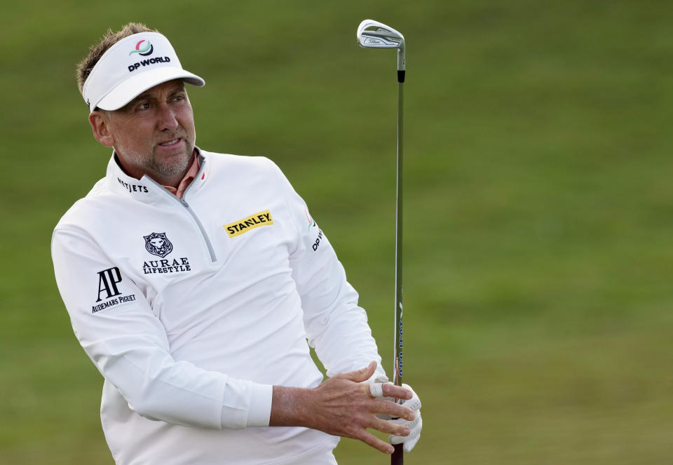 Ian Poulter of England follows his ball on the 18th hole during the second round of the Abu Dhabi Championship golf tournament at the Yas Links Golf Course, in Abu Dhabi, United Arab Emirates, Friday, Jan. 21, 2022. (AP Photo/Kamran Jebreili)