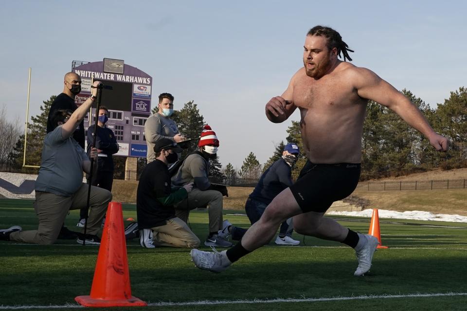 UW Whitewater lineman Quinn Meinerz runs at the school's pro football day Tuesday, March 9, 2021, in Whitewater, Wisc. The only FCS teams hosting pro days this year were Central Arkansas, North Dakota State and South Dakota State. Division III Wisconsin-Whitewater held one only because its Senior Bowl revelation, offensive lineman Quinn Meinerz, warranted another look after his team did not play in the fall. (AP Photo/Morry Gash)