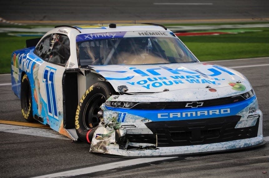 Daniel Hemric limps back to the garage after crashing with Bayley Curry late in the first stage of Saturday's Beef. It's What's for Dinner. 300.