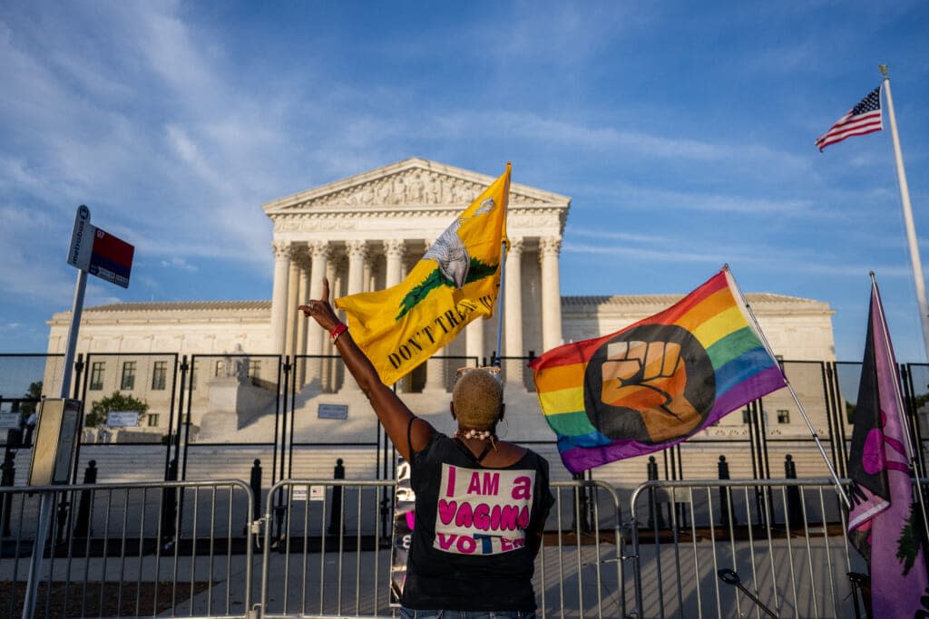 Nadine Sciler dances in front of the U.S. Supreme Court Building on June 21, 2022 in Washington, DC. (Photo by Brandon Bell/Getty Images)