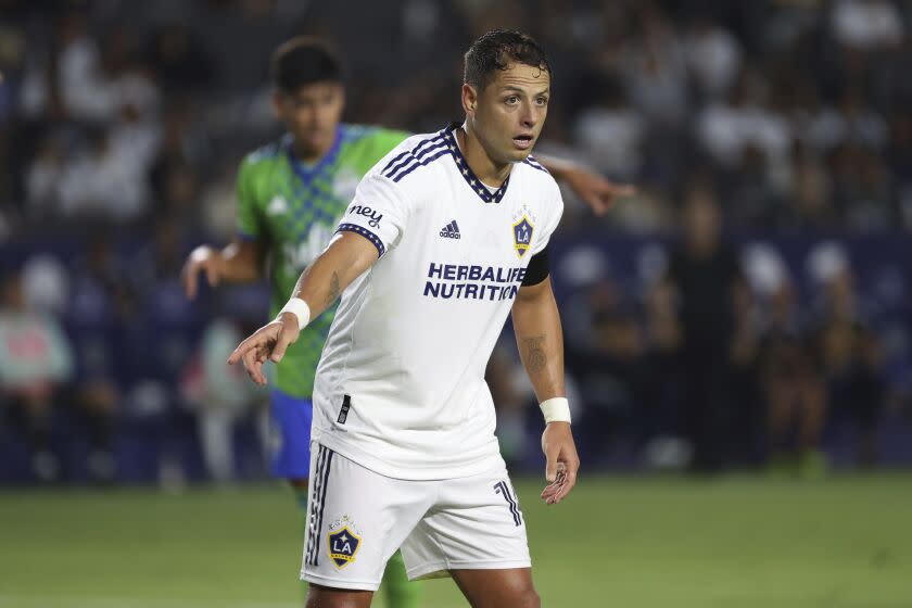 LA Galaxy forward Javier Hernández signals to a teammate during the first half of an MLS soccer match against the Seattle Sounders Friday, Aug. 19, 2022, in Carson, Calif. The match ended in a tie 3-3. (AP Photo/Raul Romero Jr.)