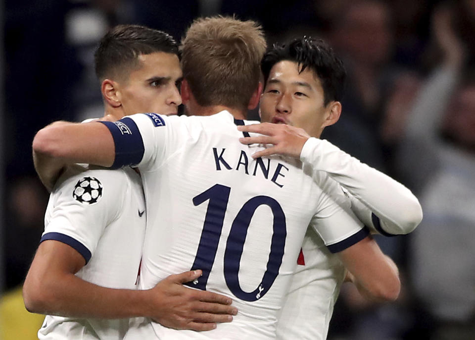 Tottenham Hotspur's Son Heung-min, right, celebrates scoring his side's second goal of the game with Harry Kane and Erik Lamela during the Champions League Group B match against Red Star at Tottenham Hotspur Stadium, London, Tuesday Oct. 22, 2019. (Nick Potts/PA via AP)