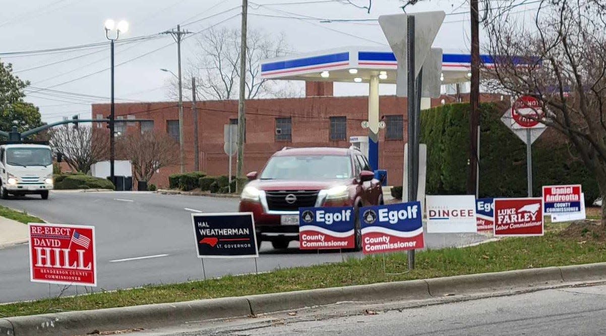 Campaign signs are lined up along a stretch of North Main Street in Hendersonville.