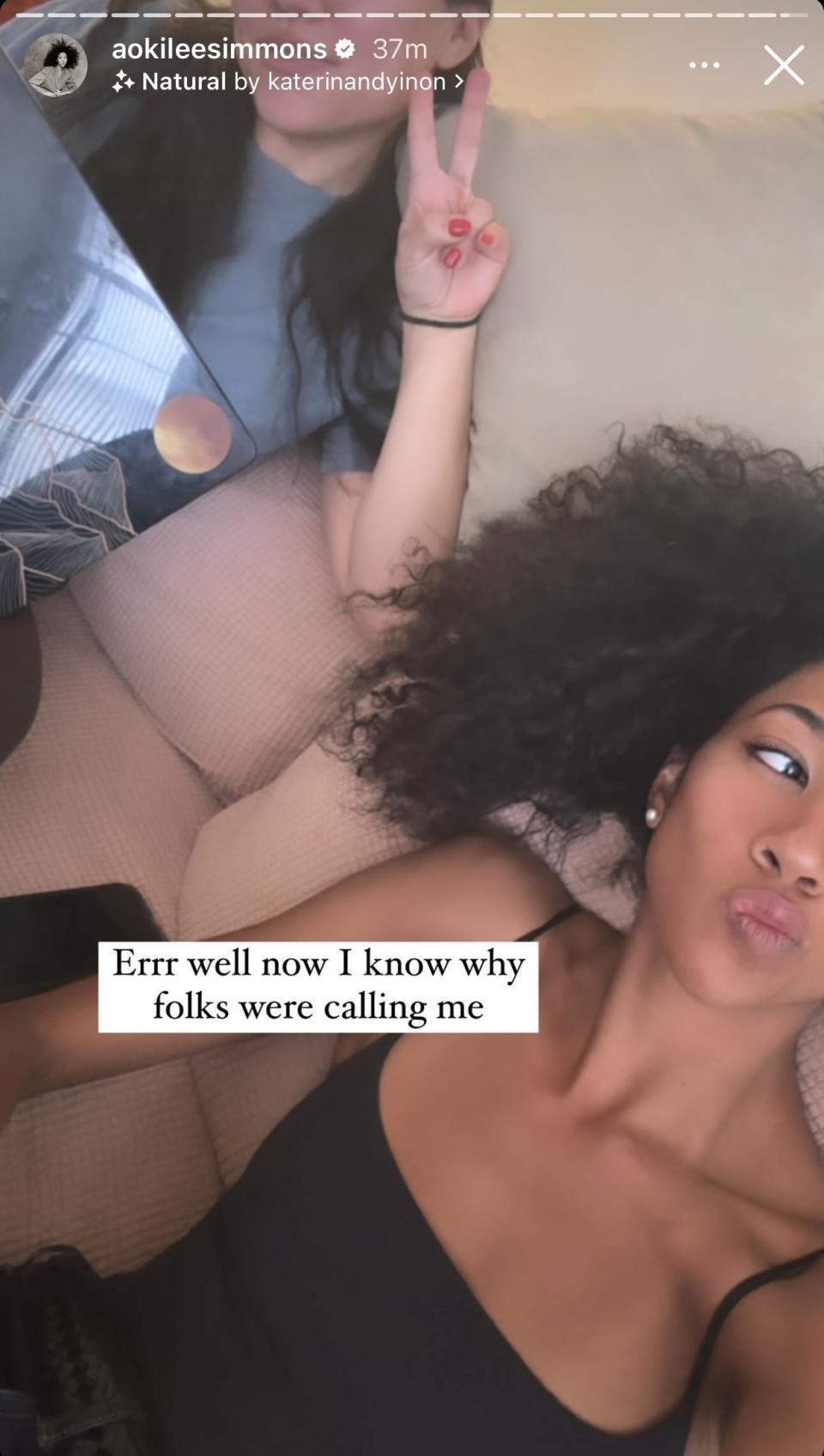 Aoki Lee Simmons lying on a couch