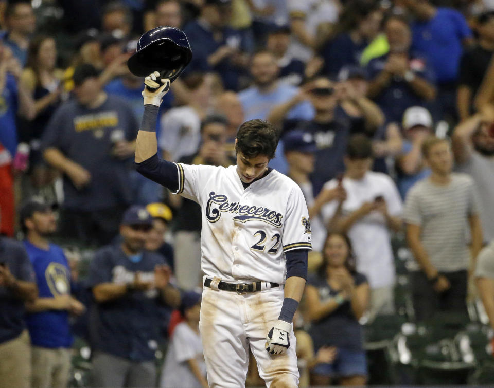 FILE - In this Monday, Sept. 17, 2018, file photo, Milwaukee Brewers' Christian Yelich reacts after receiving a standing ovation from the crowd after hitting a triple to complete the cycle during the sixth inning of a baseball game against the Cincinnati Reds, in Milwaukee. When Yelich takes the field against the Los Angeles Dodgers, he’ll have one group of Milwaukee fans rooting especially loud for his success: Serbian-Americans. (AP Photo/Aaron Gash, File)