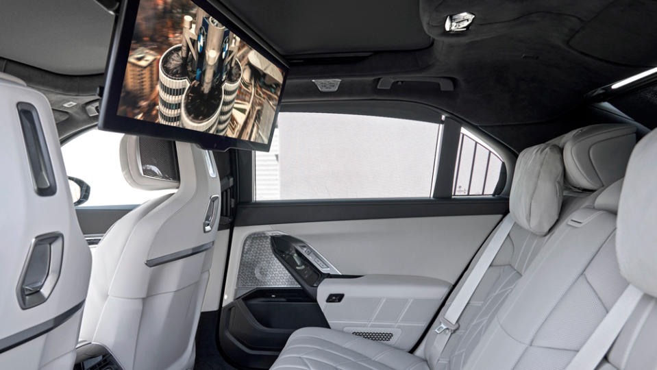 The interior of the 2023 BMW i7 xDrive60 with its 31.3-inch Theater Screen for passengers in the backseats.