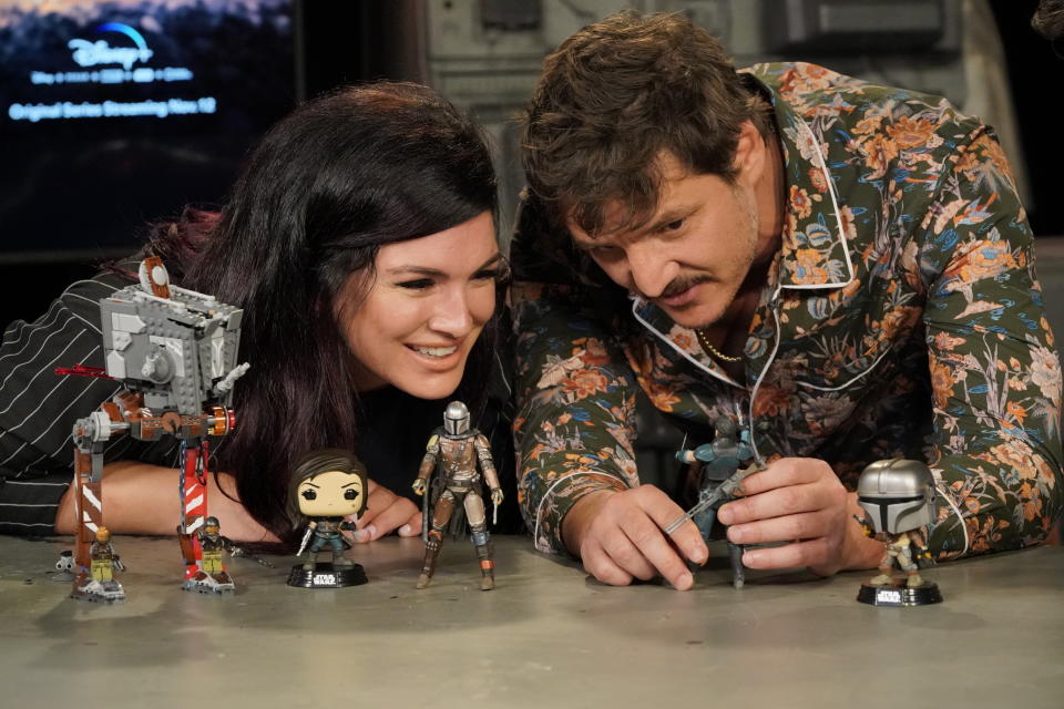 Gina Carano and Pedro Pascal check out all the 'Mandalorian' toys that will be on sale on Triple Force Friday (Photo: Lisa Rose/Lucasfilm)