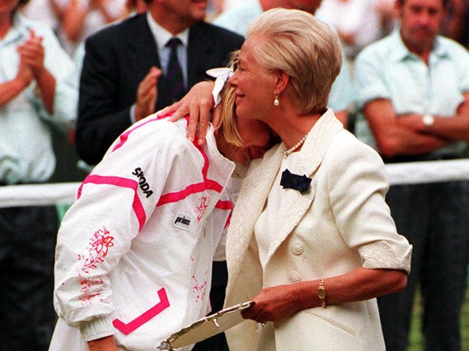 The Duchess of Kent hugs Novotna after she lost to defending champion Steffi Graf in the women’s singles final at Wimbledon in 1993 (PA)