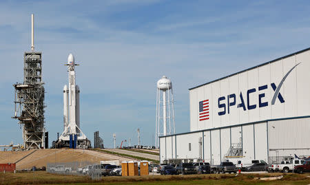 A SpaceX Falcon Heavy rocket stands on historic launch pad 39A as it is readied for its first demonstration flight at the Kennedy Space Center in Cape Canaveral, Florida, U.S., February 5, 2018. REUTERS/Joe Skipper