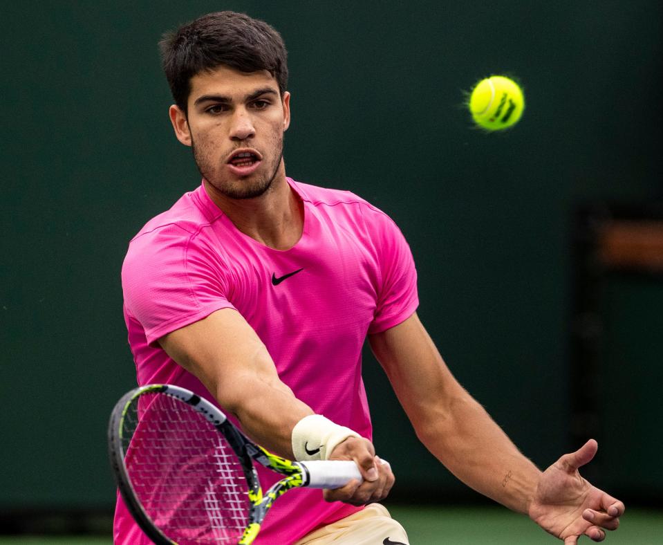 Carlos Alcaraz of Spain hits to Daniil Medvedev of Russia during the men's singles final at the BNP Paribas Open of the Indian Wells Tennis Garden in Indian Wells, Calif., Sunday, March 19, 2023. 