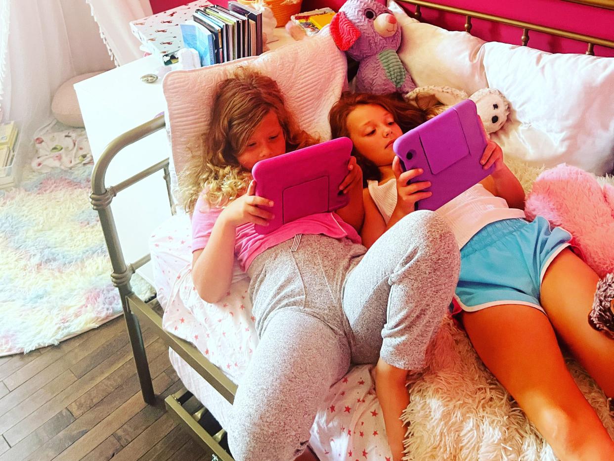 Olivia Christensen's kids watching their iPads