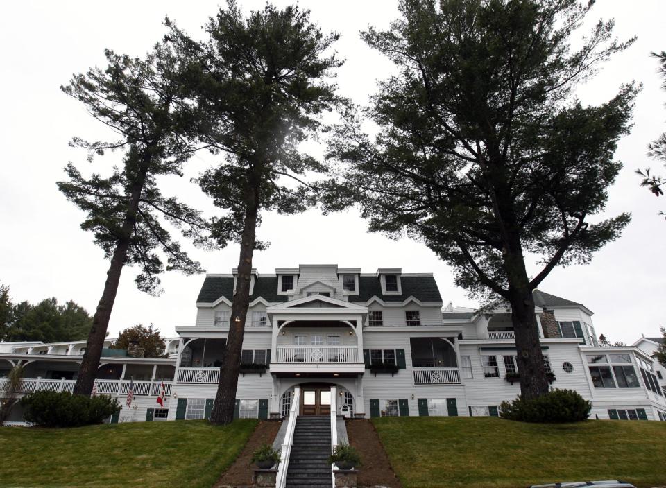 FILE - This file photo taken Nov. 13, 2009, shows the Mirror Lake Inn, in Lake Placid, N.Y. Welcome to the Mirror Lake Inn Resort and Spa, where hospitality is personal — but it's not just about the guests. Many of the inn's 165 employees stay for years. (AP Photo/Mike Groll, File)