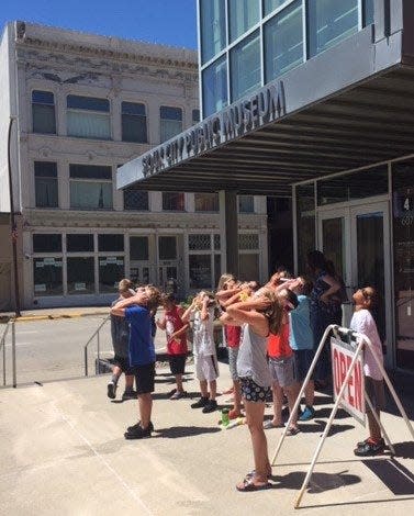 Viewers during a previous solar eclipse at the Sioux City Public Museum inn Sioux City, IA.