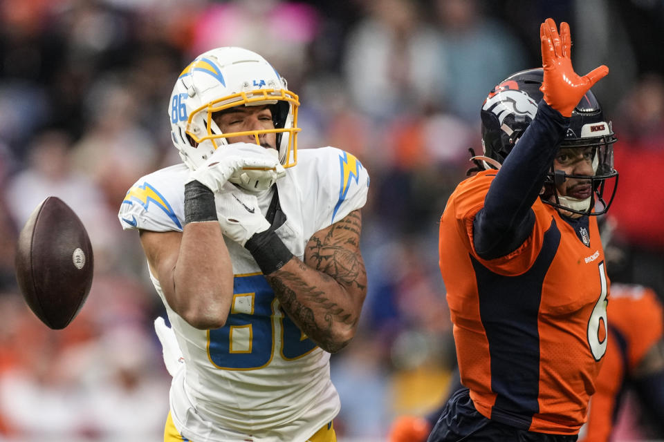 Los Angeles Chargers wide receiver Keelan Doss (86) misses the catch against Denver Broncos safety P.J. Locke (6) during the second half of an NFL football game, Sunday, Dec. 31, 2023, in Denver. (AP Photo/David Zalubowski)