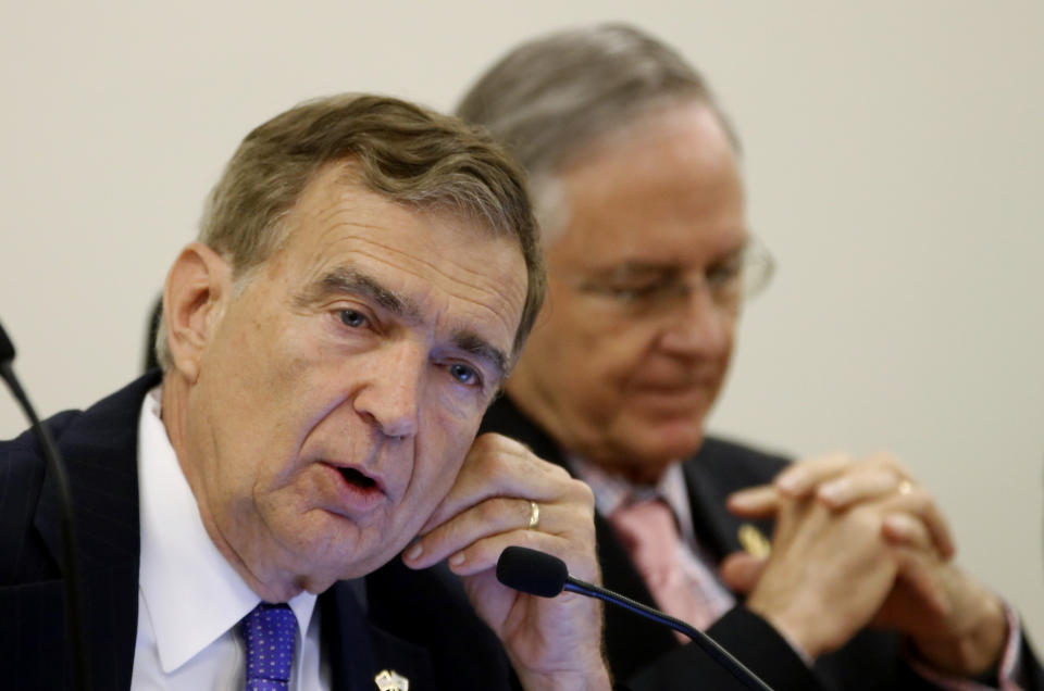 FILE - In this Tuesday, May 29, 2018 file photo, co-chairman of the Senate Finance committee, State Sen. Emmett Hanger, R-Augusta, left, as he speaks during a meeting of the Senate Finance Committee as co-chairman State Sen. Thomas Norment, R-James City County, right, listens at the Capitol in Richmond, Va. Hanger is facing a spirited opponent in Tuesday's election. (AP Photo/Steve Helber)