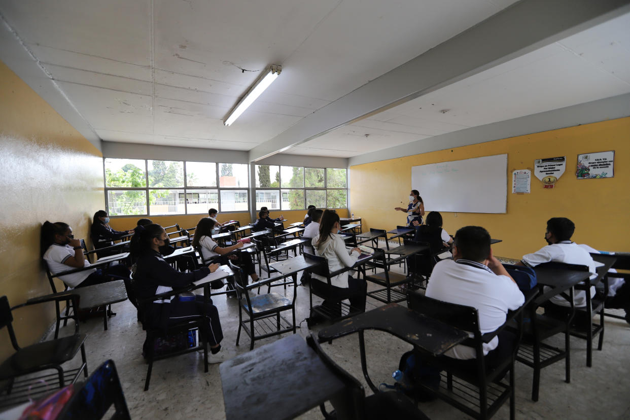 SALTILLO, MEXICO - AUGUST 30: Students take classe at the Federico Berrueto Ramón TM during the return to in person classes in Mexico on August 30, 2021 in Saltillo, Mexico. In person classes begin today in 21 of the 32 states in the country amid a sense of mistrust, contagions with Covid-19 continue while the younger population is now considered the one under a bigger risk. Authorities in Mexico have stated that schools are ready to receive their students with a well-structured protocol developed alongside the Ministry of Education, in addition, hybrid classes in some states as well as the 'Aprende en Casa III' platform will be availbale for those families who decided not to send back their children to the classrooms. (Photo by Antonio Ojeda/Agencia Press South/Getty Images)