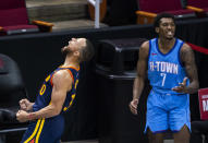 Golden State Warriors guard Stephen Curry (30) celebrates after hitting a 3-point shot over Houston Rockets guard Armoni Brooks (7) during the third quarter of an NBA game Saturday, May 1, 2021, in Houston. (Mark Mulligan/Houston Chronicle via AP)