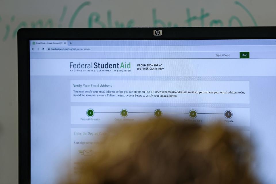 Students and families complete FAFSA forms online during an assistance event at Greenwood Community High School on Wednesday, Feb. 26, 2020.