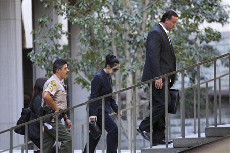 Nadya Suleman, the single mother of 14 children including octuplets popularly dubbed "Octomom", leaves court after her arraignment in Los Angeles, California, January 17, 2014. REUTERS/David McNew