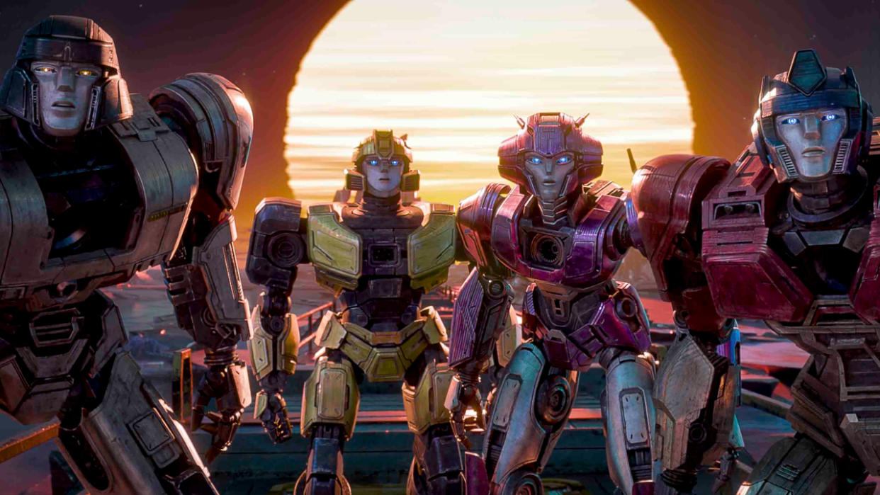  A line of Transformers staring ahead in surprise in Transformers One. 
