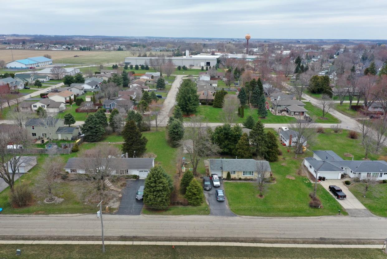 <span class="caption">The empty streets of Hebron, Illinois, population 1,200, a village three miles south of the Illinois/Wisconsin border.</span> <span class="attribution"><a class="link " href="https://www.gettyimages.com/detail/news-photo/an-aerial-view-from-a-drone-shows-empty-streets-on-april-06-news-photo/1217271835?adppopup=true" rel="nofollow noopener" target="_blank" data-ylk="slk:Scott Olson/Getty Images;elm:context_link;itc:0;sec:content-canvas">Scott Olson/Getty Images</a></span>