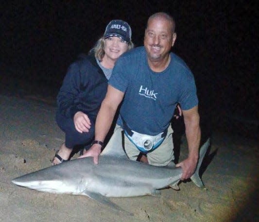 Here's Anna and Mark, from North Carolina, with a black-tip they caught on an outing with NSB Shark Hunters in Bethune Beach.