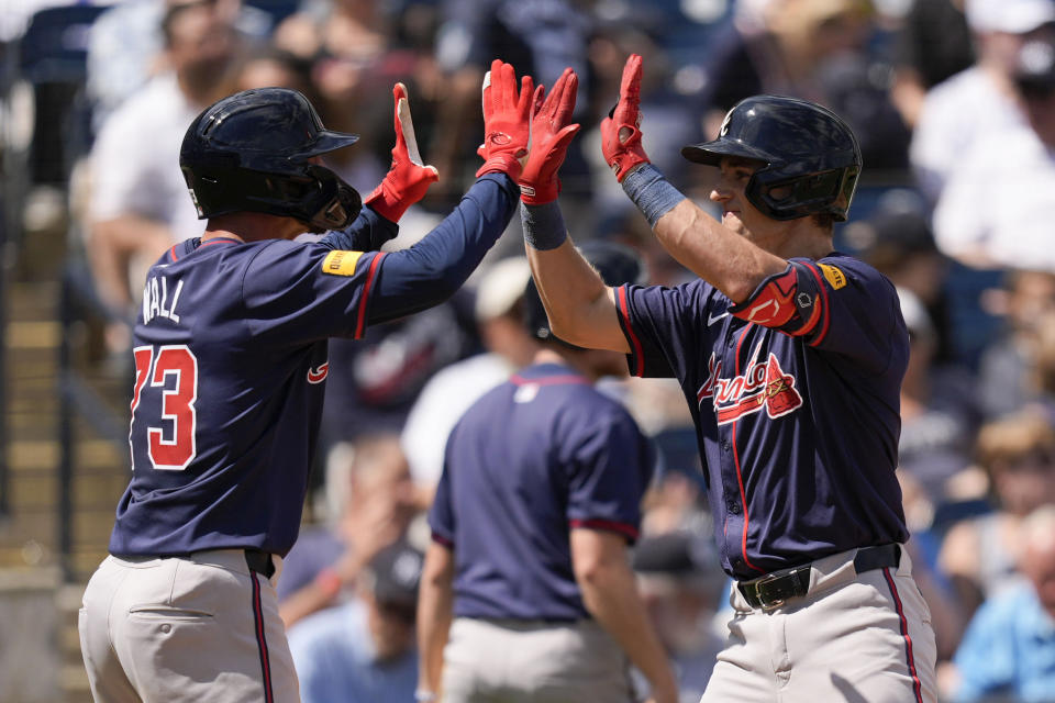 Atlanta Braves' Luke Williams celebrates with teammate Forrest Wall, left, after hitting a home run in the fourth inning of a spring training baseball game against the New York Yankees Sunday, March 10, 2024, in Tampa, Fla. (AP Photo/Charlie Neibergall)