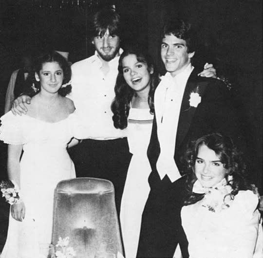 <p>Teenage Brooke Shields took a night off from her work as an actress and model for the 1982 prom at Englewood, N.J.’s Dwight Englewood High School, but the night was still very Hollywood. “My date was Ted McGinley, if you can believe it, from <em>Love Boat</em>,” she told the <a rel="nofollow noopener" href="http://nypost.com/2010/04/25/brooke-shields-the-way-i-wore/" target="_blank" data-ylk="slk:New York Post;elm:context_link;itc:0;sec:content-canvas" class="link ">New York Post</a> in 2010. “We were dating at the time, and he said he would fly in from California to be my date.” Not to mention that Shields’s dress was one from her latest film, Sahara, designed by none other than Valentino. (Photo: Seth Poppel/Yearbook Library) </p>