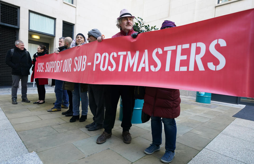Protestors outside the Post Office Horizon IT inquiry at the International Dispute Resolution Centre, London, ahead of the one-day hearing on issues relating to compensation. Between 2000 and 2014, more than 700 sub-postmasters and sub-postmistresses (SPMs) were falsely prosecuted based on information from the Horizon computer system, installed and maintained by Fujitsu. Picture date: Thursday December 8, 2022. (Photo by Kirsty O'Connor/PA Images via Getty Images)
