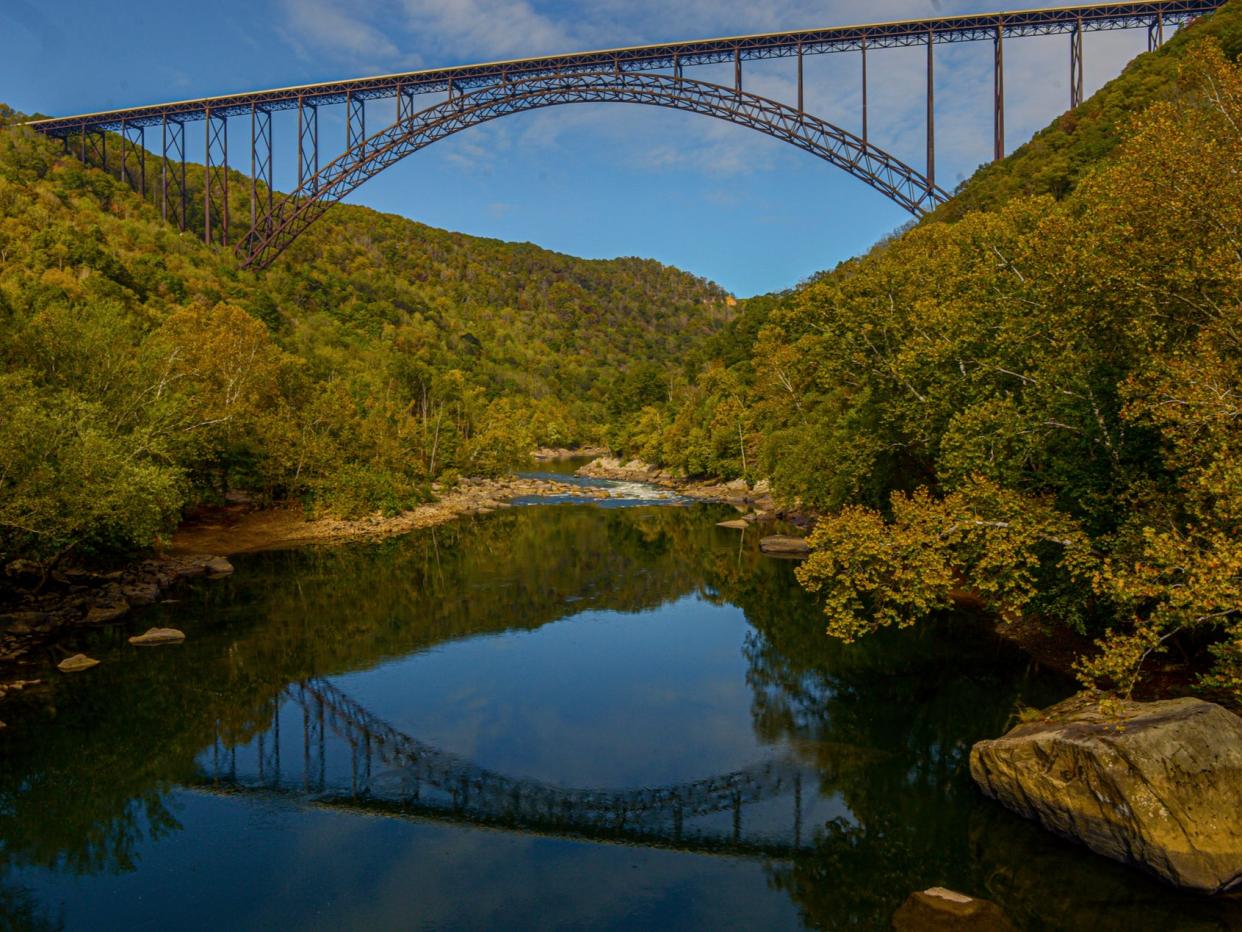 <p>The New River Gorge Bridge is seen from Fayette Station in Fayetteville, WVa A program launched Monday on 12 April 2021</p> ((AP))