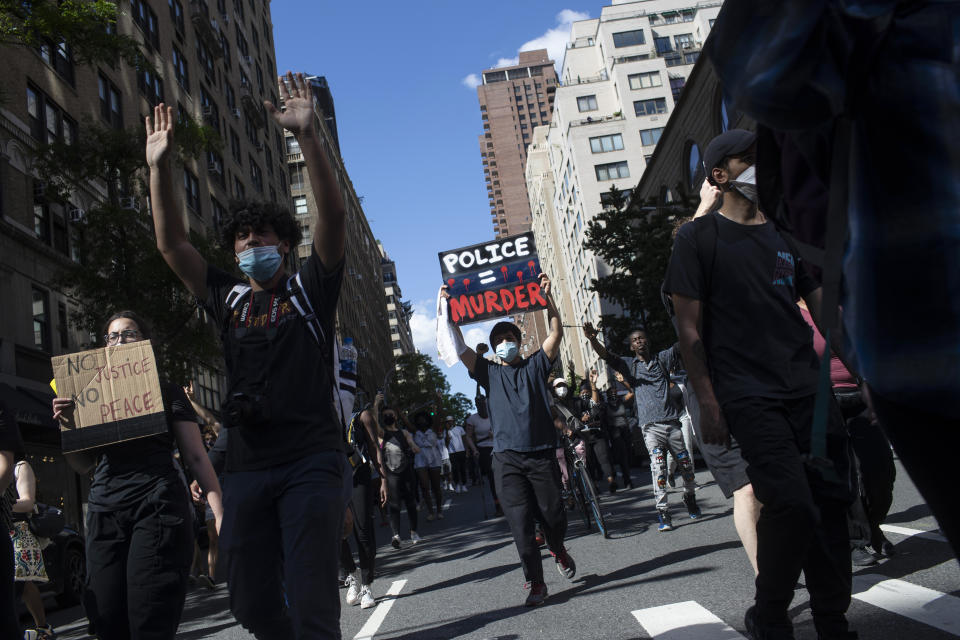 Protesters march during a solidarity rally for George Floyd, Saturday, May 30, 2020, in New York. Demonstrators took to the streets of New York City to protest the death of Floyd, a black man who died after he was taken into police custody in Minneapolis on Memorial Day. (AP Photo/Wong Maye-E)