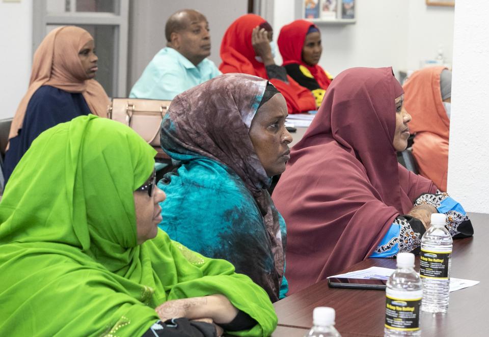 Somali refugees and immigrants listen during a child care class at Family and Child Care Resources of Northeast Wisconsin in Green Bay.