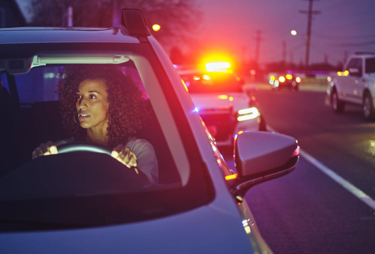 <span class="caption">Black drivers are more likely to encounter police regardless of how they drive, research shows. </span> <span class="attribution"><a class="link " href="https://www.gettyimages.com/detail/photo/nightime-police-traffic-stop-royalty-free-image/1291419534?adppopup=true" rel="nofollow noopener" target="_blank" data-ylk="slk:Rich Legg/Getty Images;elm:context_link;itc:0;sec:content-canvas">Rich Legg/Getty Images</a></span>