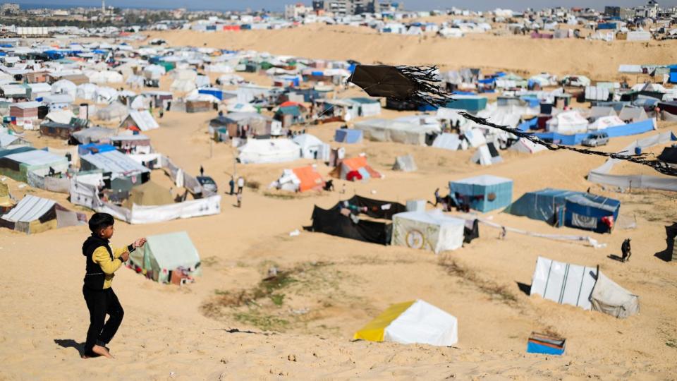 PHOTO: A displaced Palestinian boy flies a kite amid the ongoing conflict between Israel and Palestinian Islamist group Hamas, at a tent camp at the border with Egypt, in Rafah, in the southern Gaza Strip, Feb. 8, 2024.  (Ibraheem Abu Mustafa/Reuters)