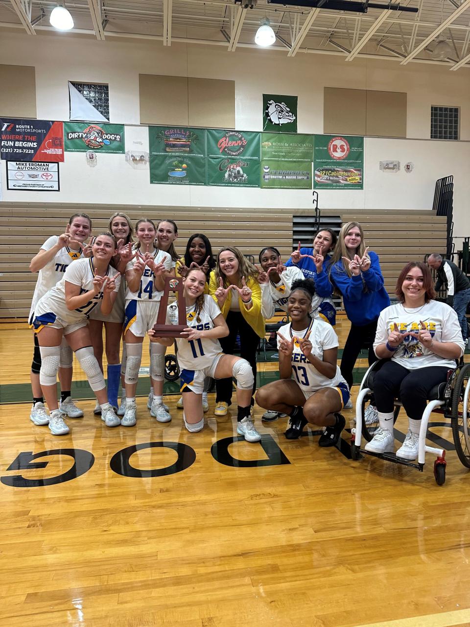 The Martin County High School girls basketball team poses for picture after winning the District 8-6A championship with a 53-49 win over Heritage on Friday, Feb. 9, 2024 from Melbourne High School.