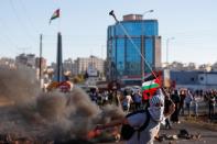 Palestinians protest against Israeli flag-waving procession