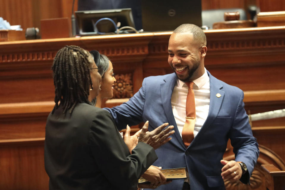 South Carolina Sen. Deon Tedder, D-Charleston hugs his family after he is sworn in as a state senator on Tuesday, Jan. 9, 2024. (AP Photo/Jeffrey Collins)