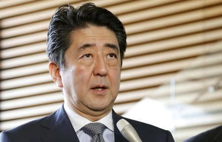 Japan's Prime Minister Shinzo Abe speaks to the media at his official residence in Tokyo in this photo taken by Kyodo March 19, 2015. REUTERS/Kyodo