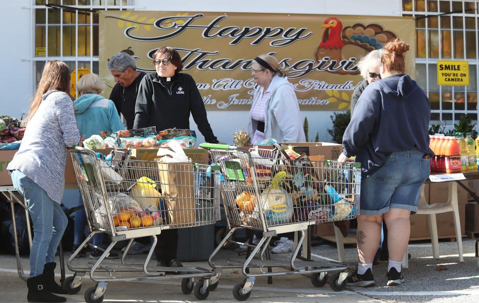 Needy residents fill shopping carts in November 2021 at the annual Thanksgiving food giveaway by the Jewish Federation of Volusia & Flagler Counties. The Federation has hired Rob Lennick as its new executive director, following the death of the organization's longtime leader Gloria Max in September 2021.