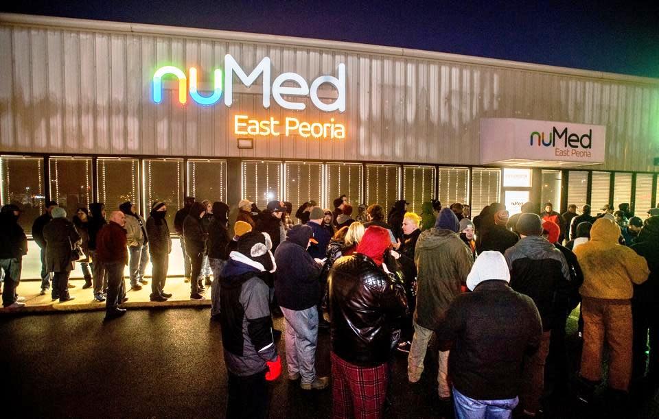 Patrons line up outside the NuMed marijuana dispensary in East Peoria, Illinois, before recreational sales began on the first day they were legal in the state, Jan. 1, 2020. NuMed is now known as NuEra Cannabis.