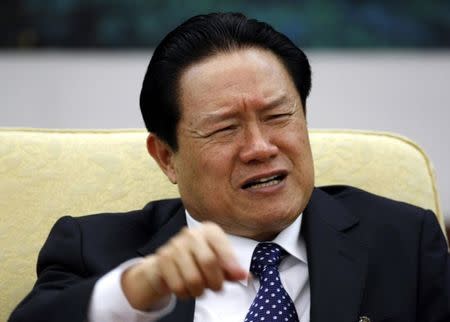 China's Public Security Minister Zhou Yongkang gestures as he attends Hebei delegation discussion sessions of the 17th National Congress of the Communist Party of China in Beijing, in this October 16, 2007 file photo. REUTERS/Jason Lee/Files
