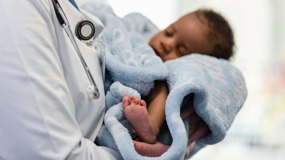 PHOTO: A newborn in a doctor's arms. (STOCK PHOTO/Getty Images)