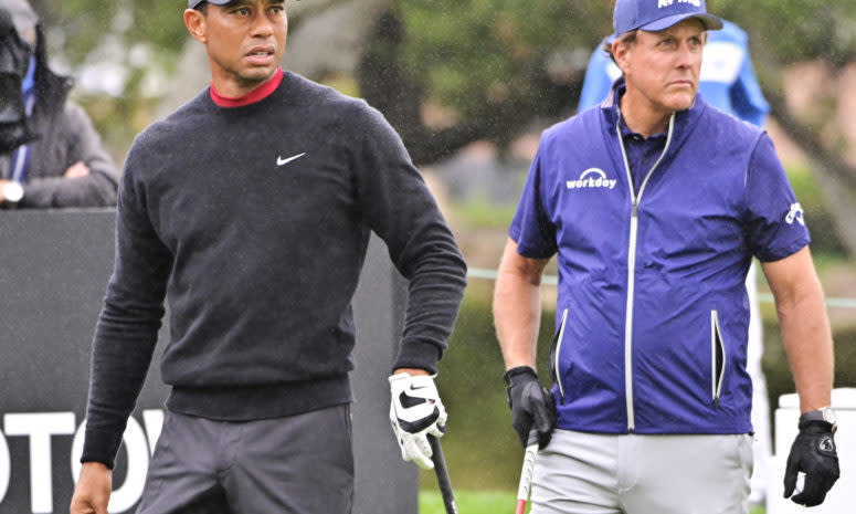 Tiger Woods and Phil Mickelson on the course.