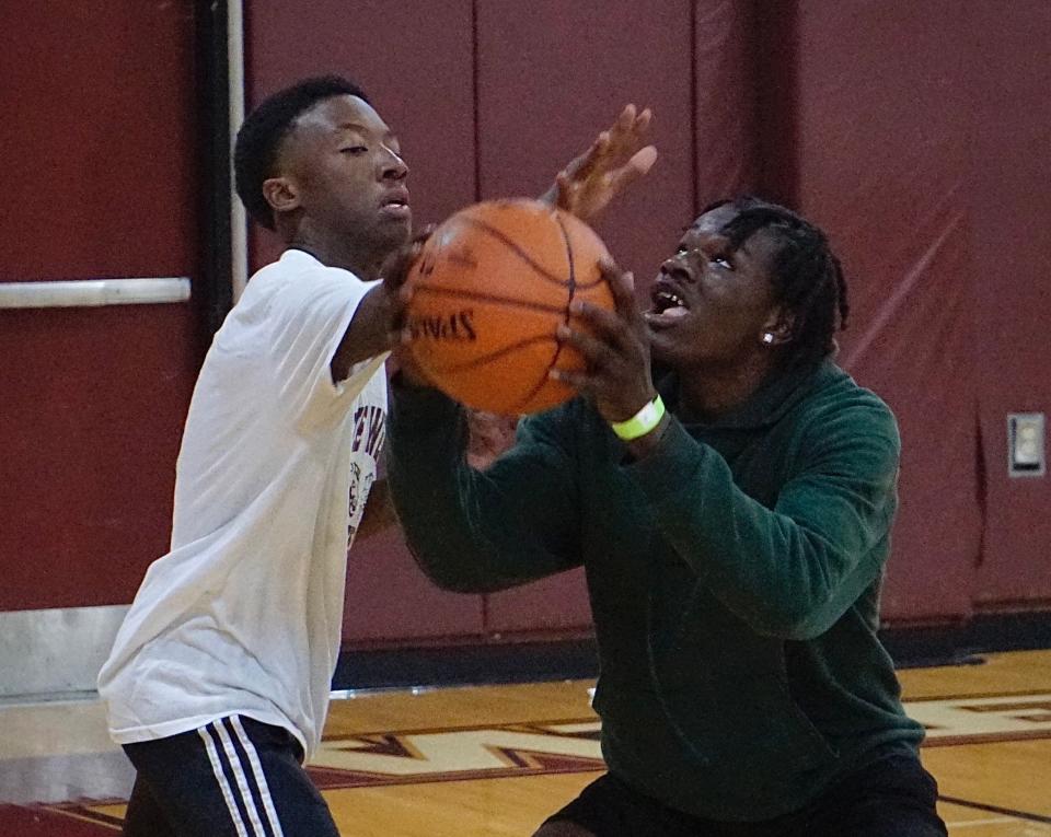 Teens play basketball at the West High fundraiser.