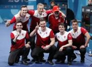 Curling - Pyeongchang 2018 Winter Olympics - Men's Bronze Medal Match - Switzerland v Canada - Gangneung Curling Center - Gangneung, South Korea - February 23, 2018 - Team Switzerland pose after winning the match. REUTERS/John Sibley