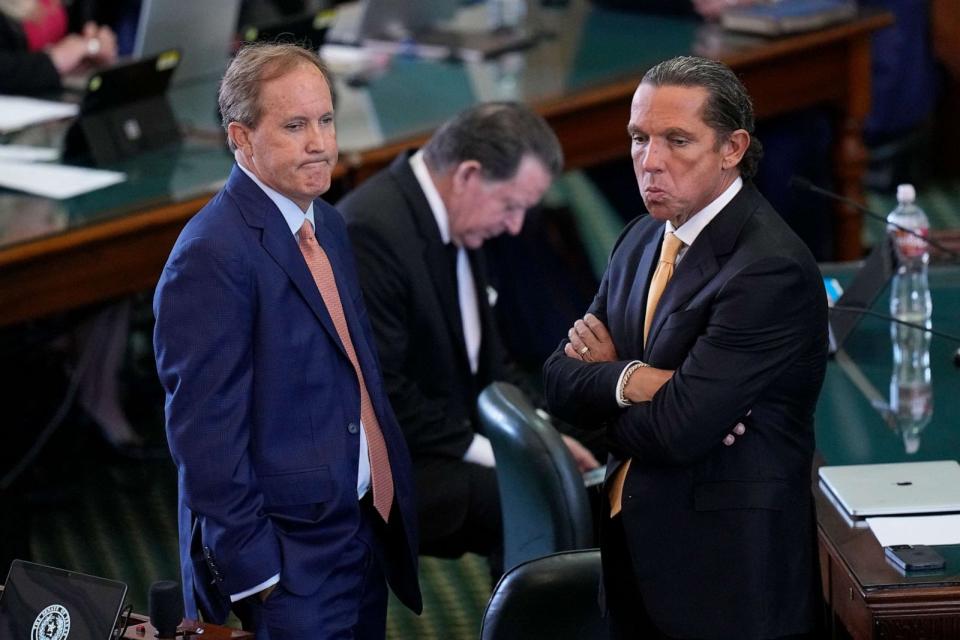 PHOTO: Texas state Attorney General Ken Paxton, left, stands with his attorney Tony Buzbee, right, before his impeachment trial in the Senate Chamber at the Texas Capitol, Sept. 5, 2023, in Austin, Texas. (Eric Gay/AP)