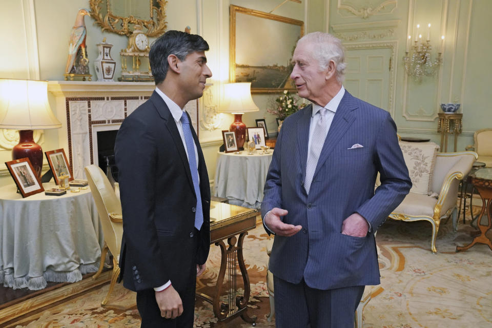 King Charles III, and Britain's Prime Minister Rishi Sunak talk during their meeting at Buckingham Palace, London, Wednesday, Feb. 21, 2024. (Jonathan Brady/Pool Photo via AP)