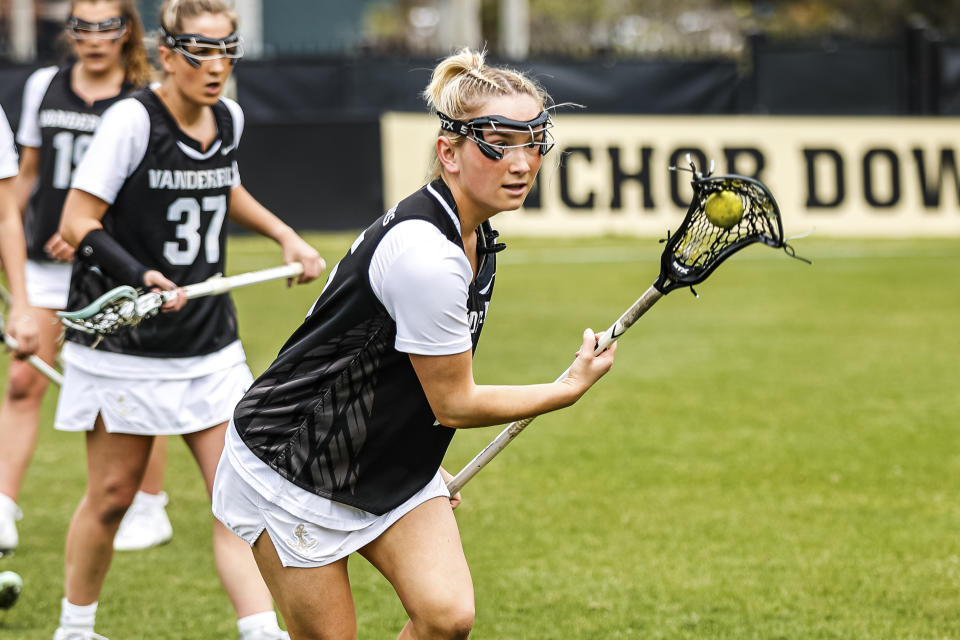 Cailin Bracken plays lacrosse with the Vanderbilt team on March 16, 2022, in Nashville, Tenn. When she became overwhelmed by college life, especially when she had to isolate upon testing positive for COVID-19 after just a few days on campus, she decided to leave the team. Bracken wrote an open letter to college sports, calling on coaches and administrators to become more cognizant of the challenges athletes face in navigating not only their competitive side, but also their social and academic responsibilities. (Josh Rehders/Vanderbilt University via AP)https://epix.ap.org/#