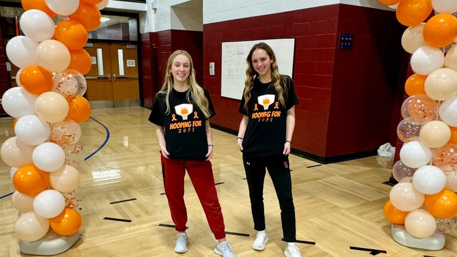 <em>Photo: A’Don Allen, Elmira’s Ellie Clearwater and Edison’s Payton Littlefield host the Hooping for Hope game. </em>