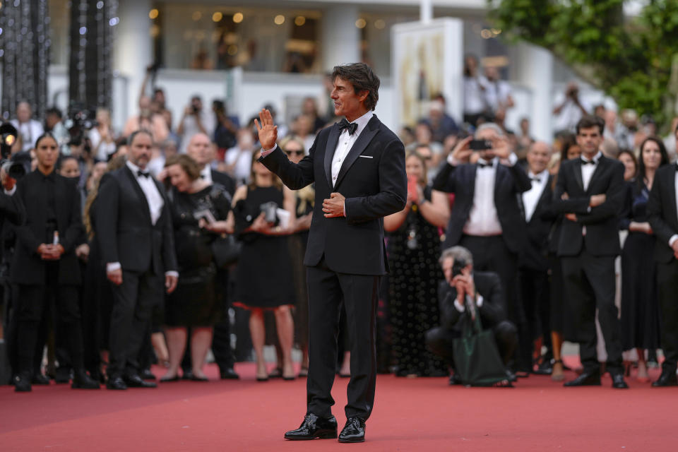 Tom Cruise poses for photographers upon arrival at the premiere of the film 'Top Gun: Maverick' at the 75th international film festival, Cannes, southern France, Wednesday, May 18, 2022. (AP Photo/Petros Giannakouris)